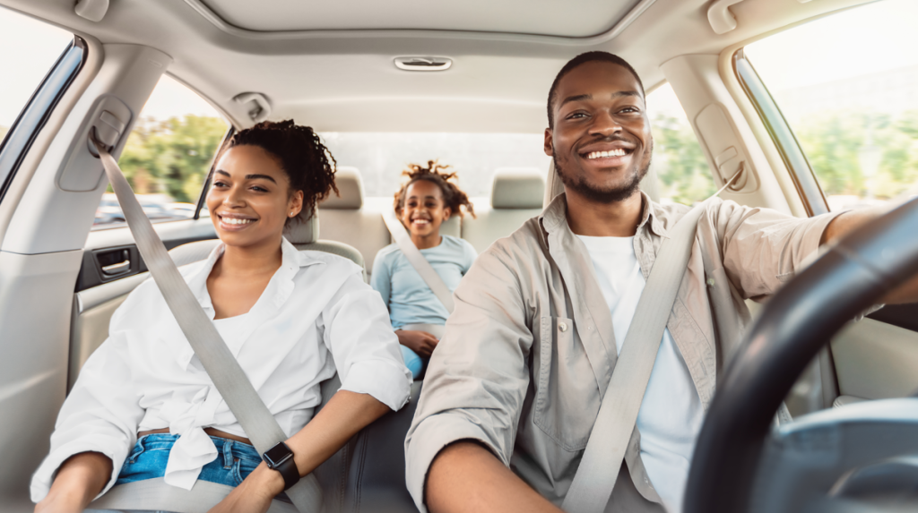 A family in their car driving.