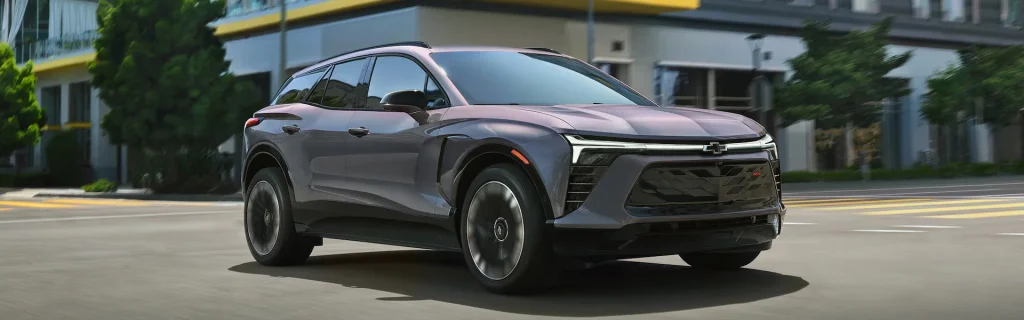 Chevrolet Equinox EV electric SUV in motion, showcasing contemporary design and everyday urban versatility.